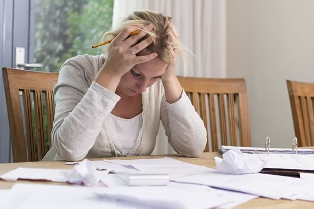 adult woman frustrated over insurance paperwork